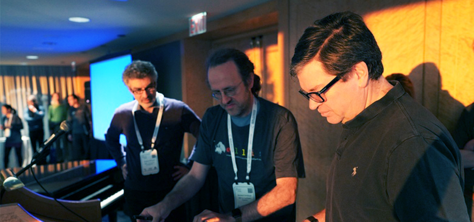 three event attendees interacting